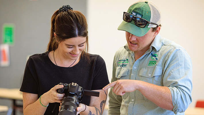 Students in class receiving tips for their camera 